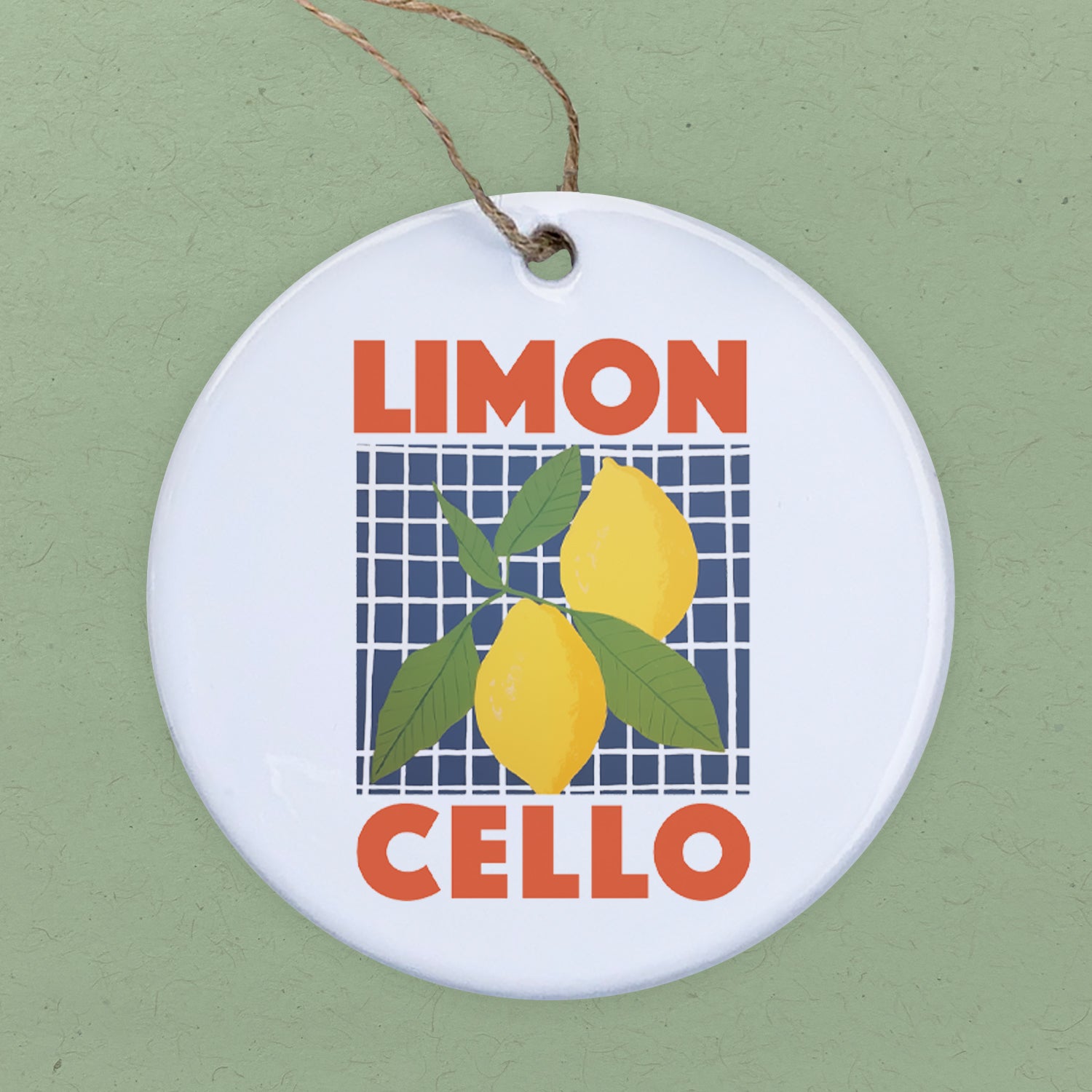 A beautifully crafted Limoncello Ornament made of high-quality porcelain, featuring vibrant designs and a glossy finish, perfect for holiday decor.