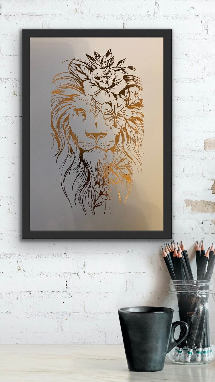 A stunning lion foil print featuring a rose gold lion on a white background, symbolizing courage and strength.