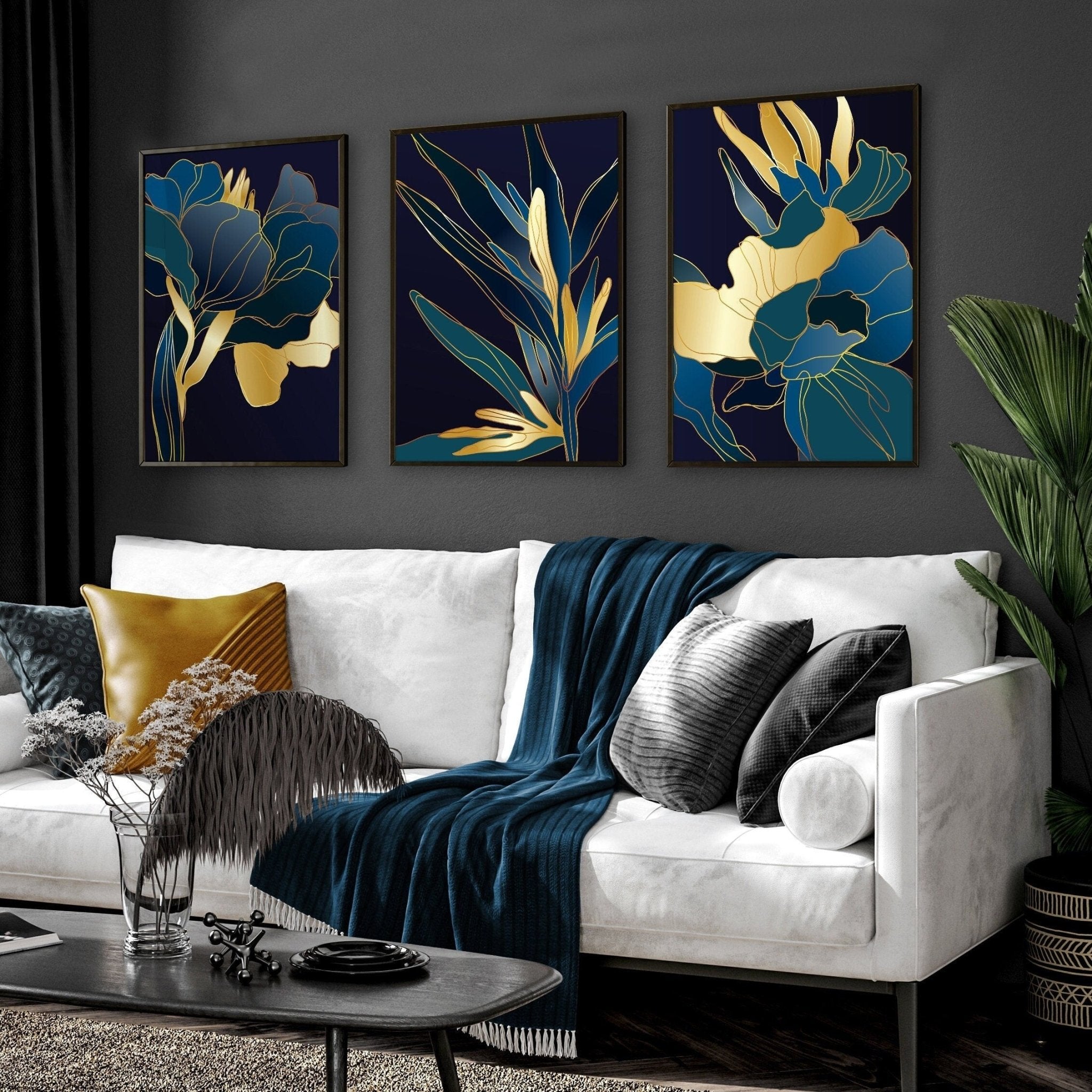 Set of 3 teal wall art prints featuring modern botanical designs in vibrant colors, perfect for enhancing living room decor.