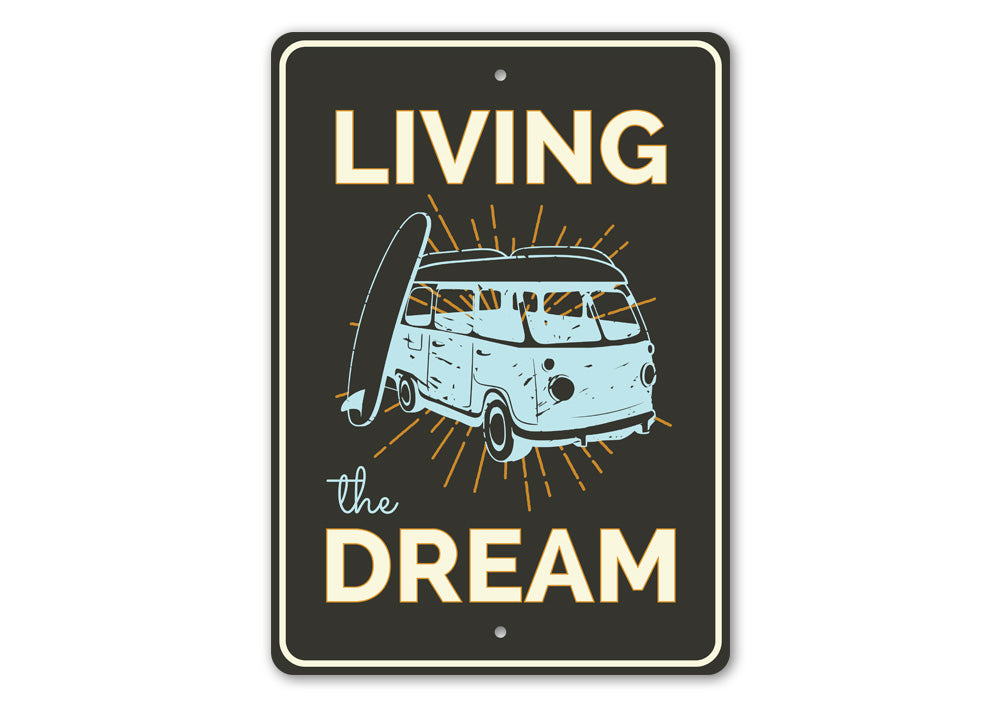 A decorative Living the Dream sign made of high-quality aluminum, featuring a beach-themed design, perfect for coastal decor.