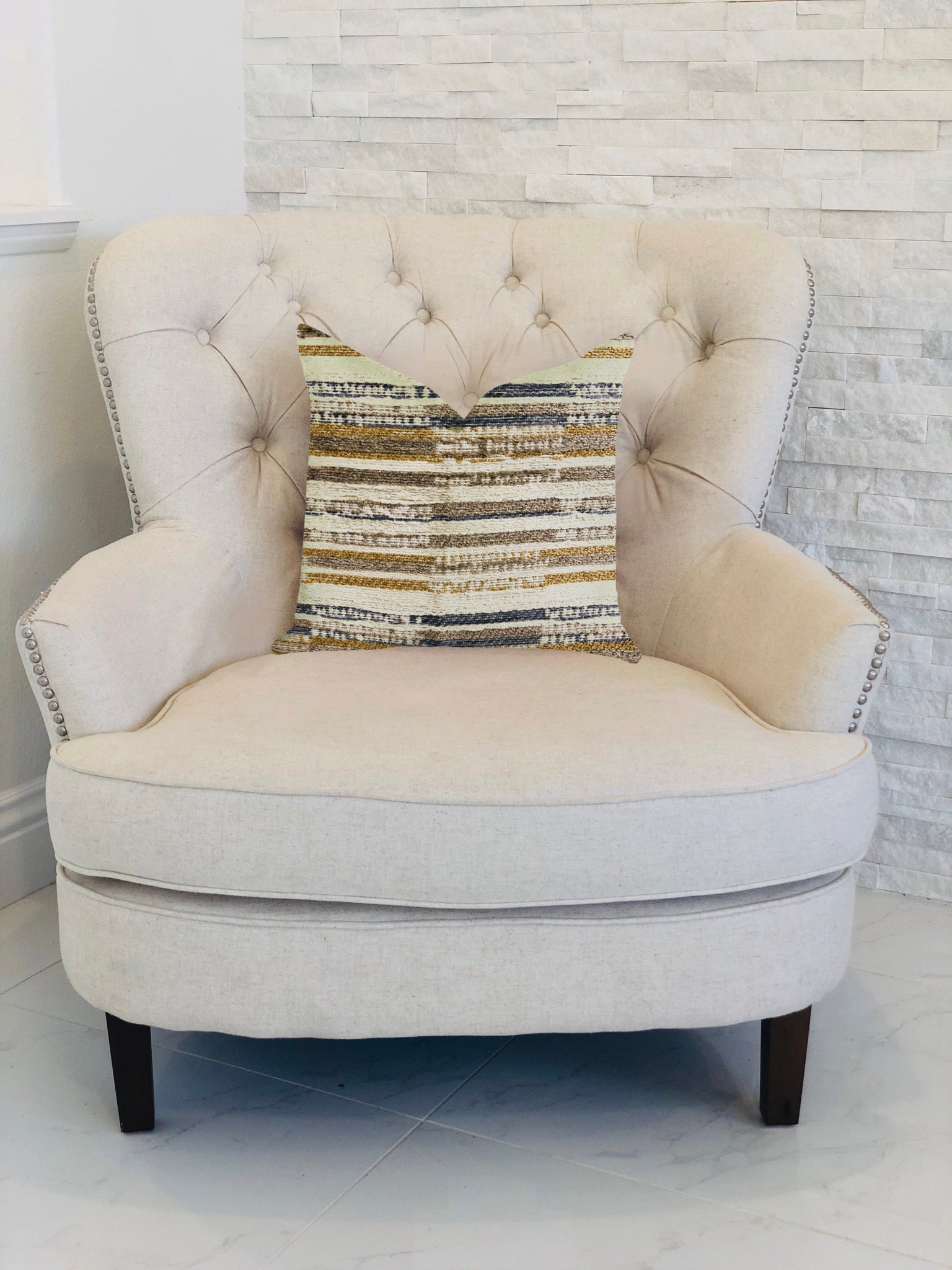 Lombardi Lane luxury throw pillow in beige, gray, and gold, showcasing a stylish double-sided design with an invisible zipper.