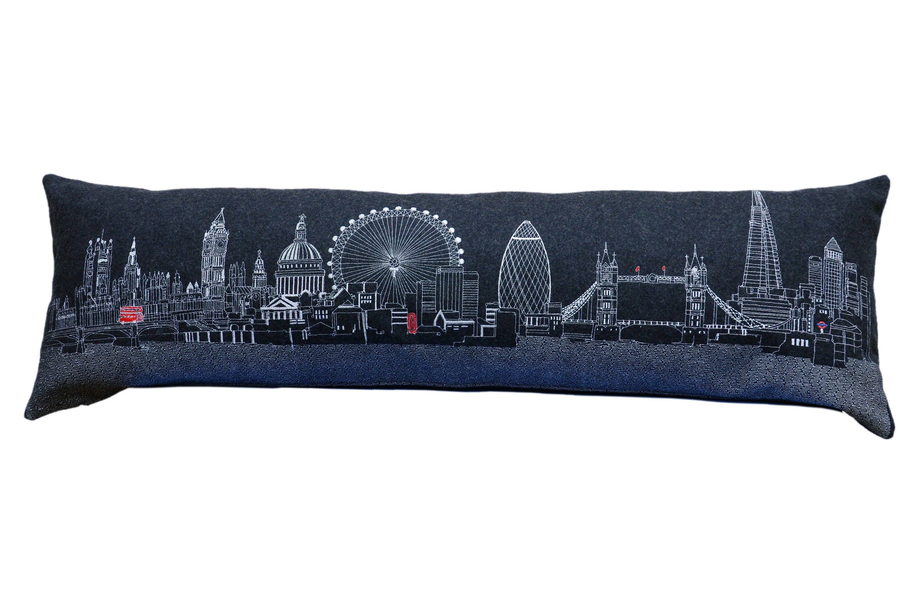 Luxurious London Pillow featuring embroidered landmarks like Big Ben and the London Eye, with a red zipper at the bottom.