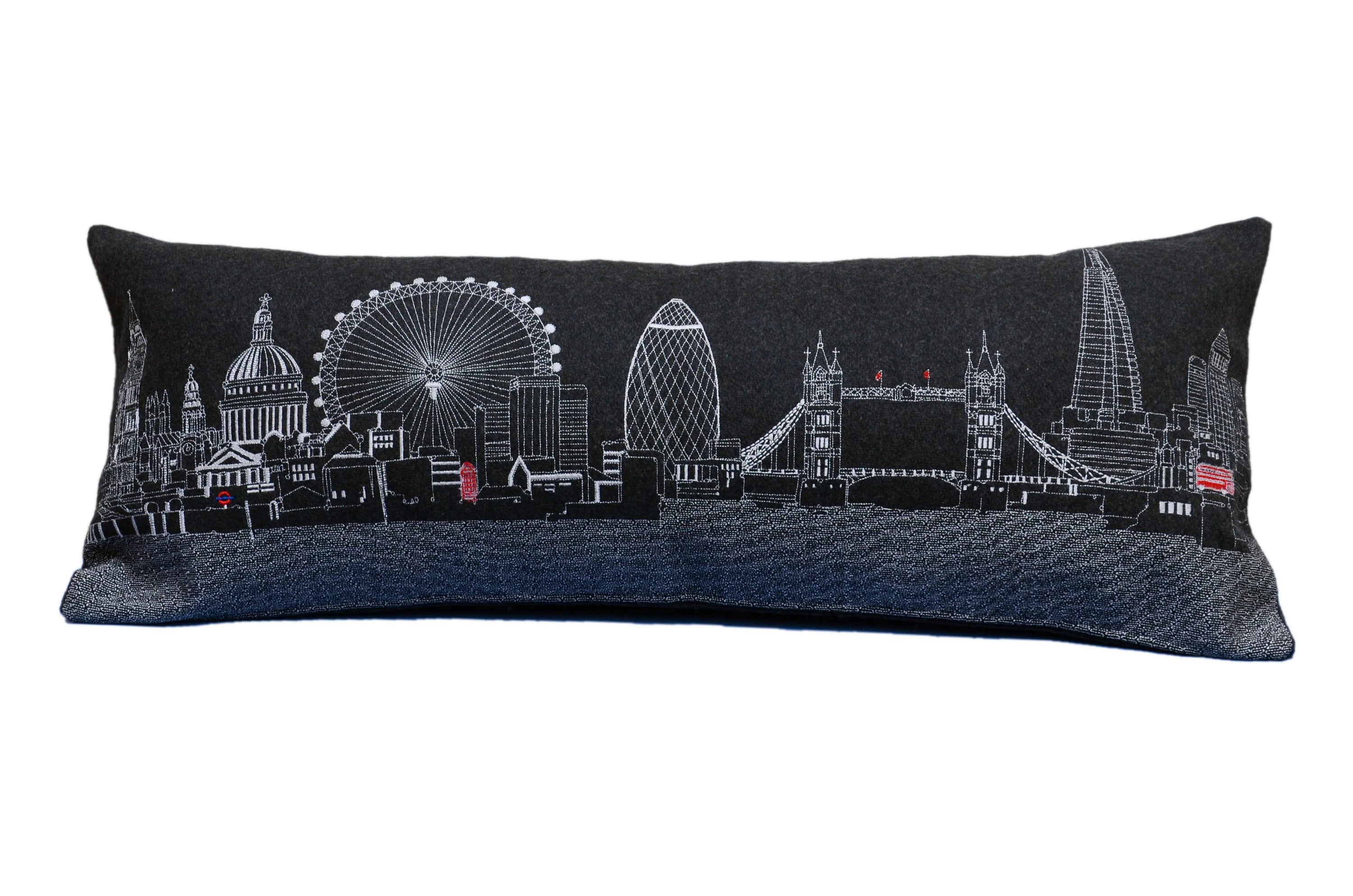 Luxurious London Pillow featuring embroidered landmarks like Big Ben and the London Eye, with a red zipper at the bottom.