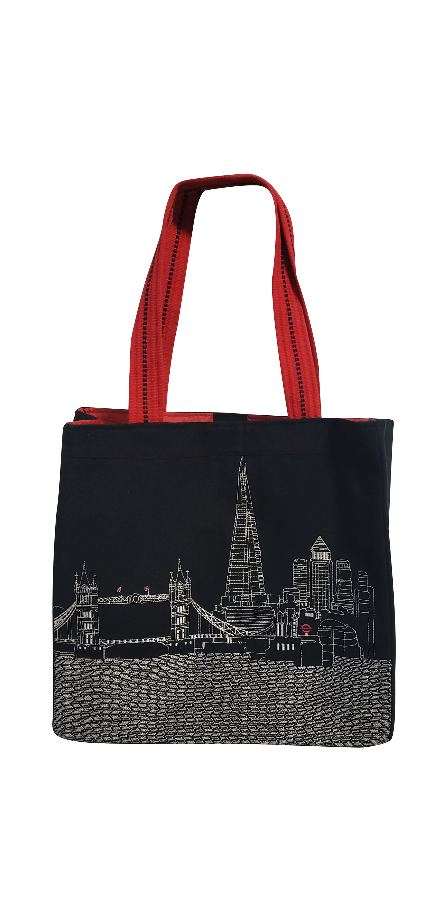 Stylish London Tote Bag with embroidered skyline design in cream and black colors, featuring red waterproof lining and ribbed straps.