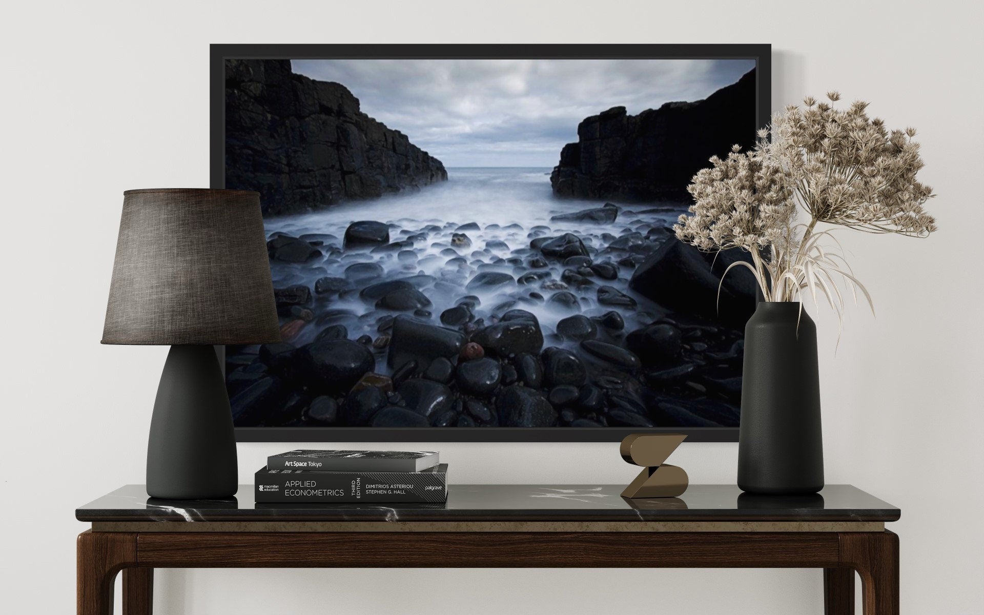 A captivating print of dark cliffs meeting a misty sea, showcasing the rugged beauty of nature in a serene atmosphere.