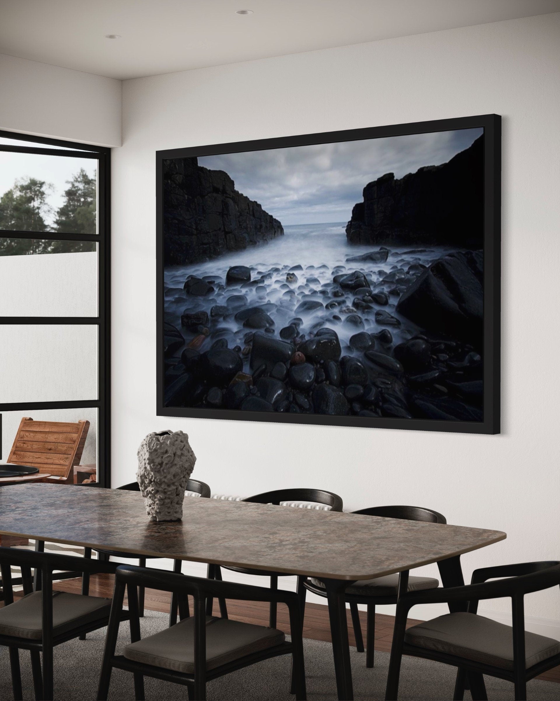 A captivating print of dark cliffs meeting a misty sea, showcasing the rugged beauty of nature in a serene atmosphere.