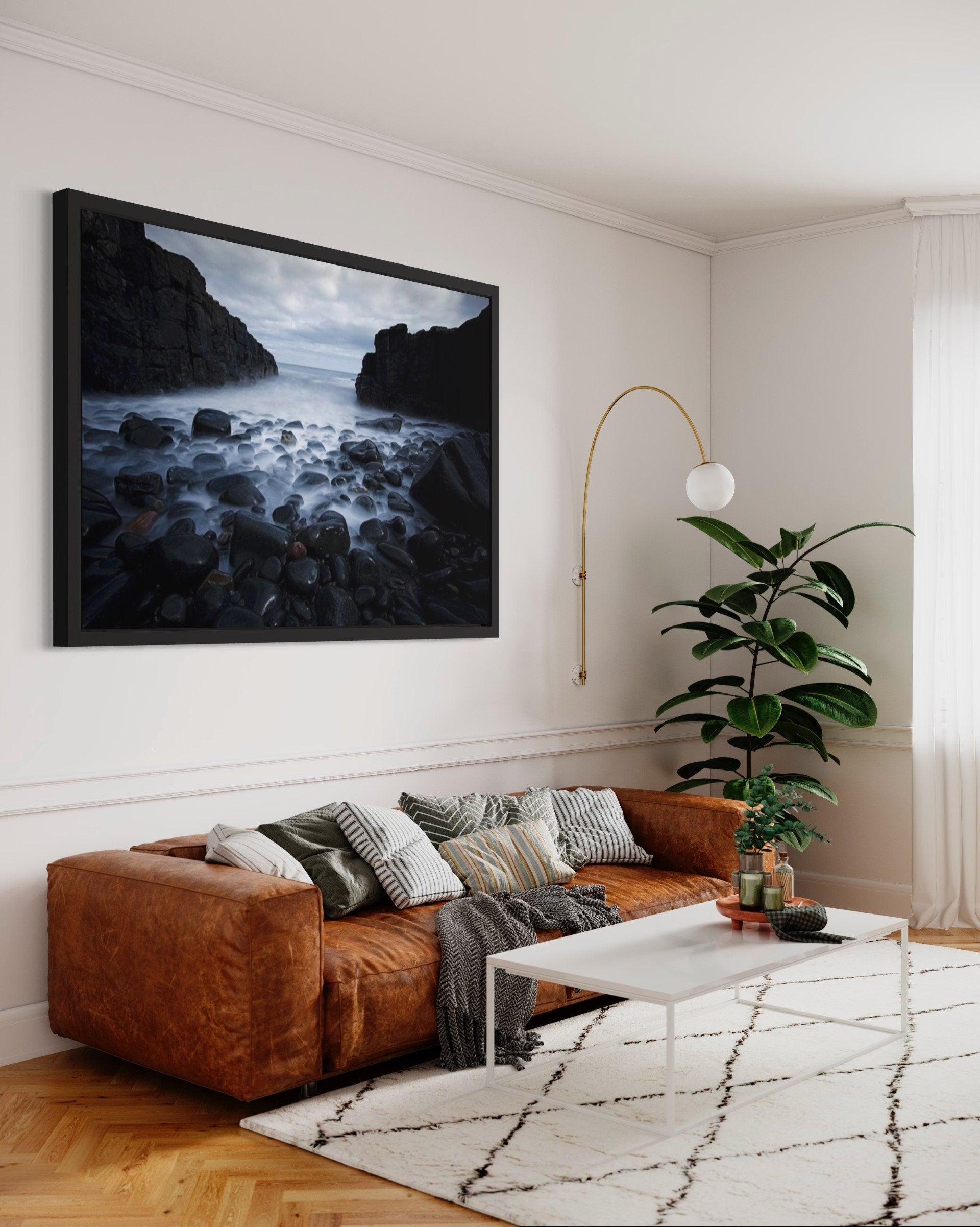 A captivating print of dark cliffs meeting a misty sea, showcasing the rugged beauty of nature in a serene atmosphere.