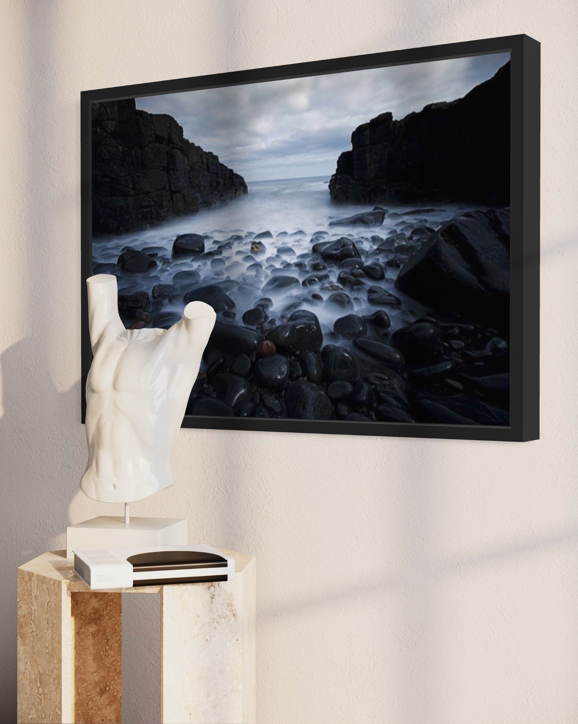 A captivating print of dark cliffs meeting a misty sea, showcasing the rugged beauty of nature in a serene atmosphere.