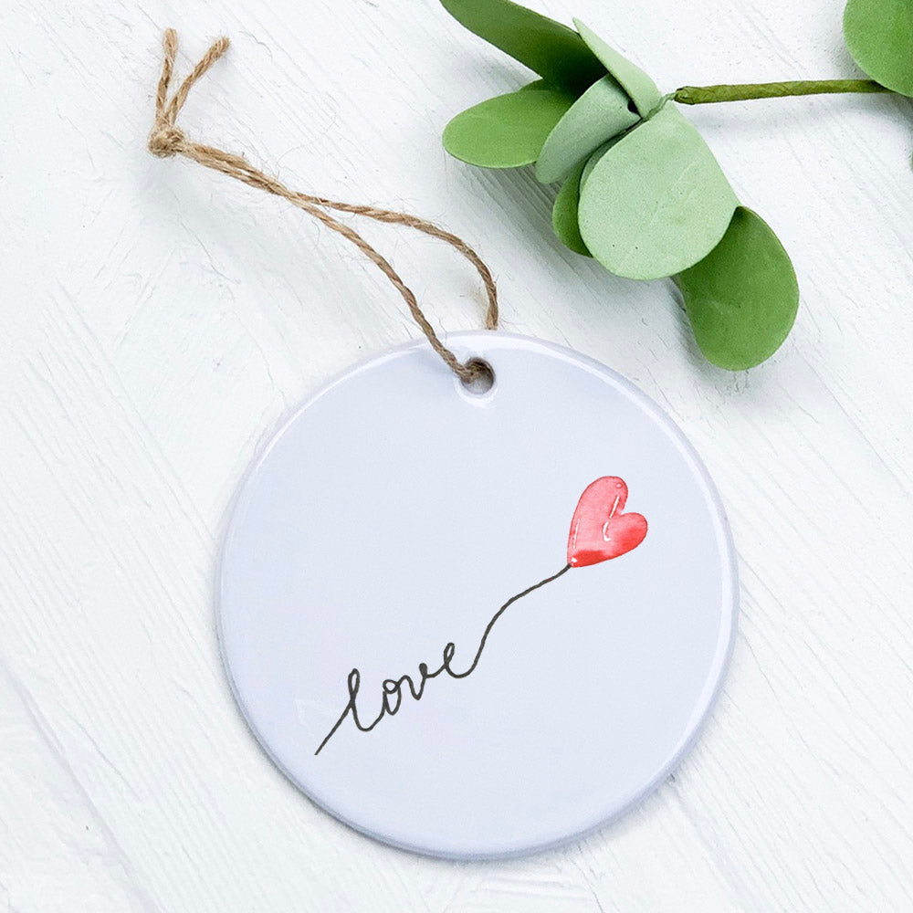 A beautifully crafted porcelain Love Heart Balloon ornament featuring a vibrant design, perfect for gifts and home decor.