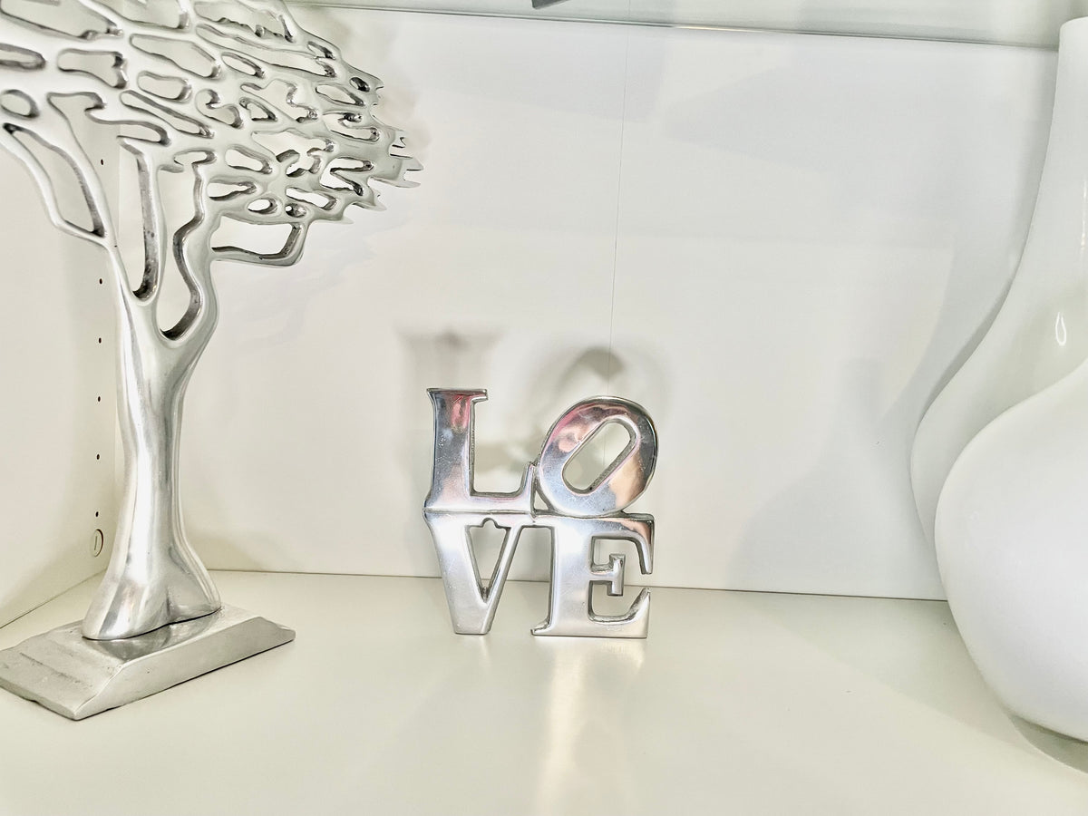 LOVE Sign Home Decor made from recycled aluminum, featuring a minimalist design with a chic hand-cast finish.