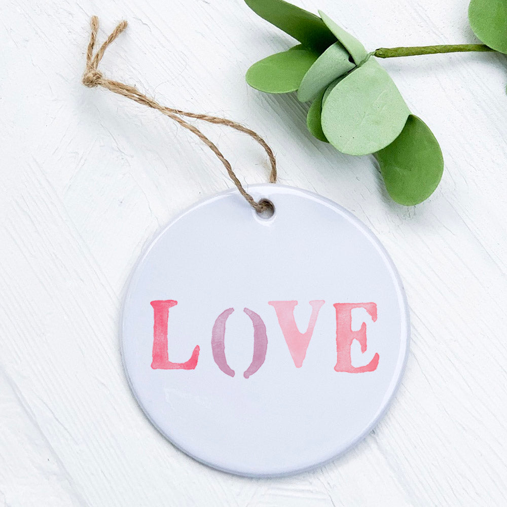 A beautifully crafted Love Stencil Ornament made of high-quality porcelain, featuring an original design with a smooth, glossy finish.