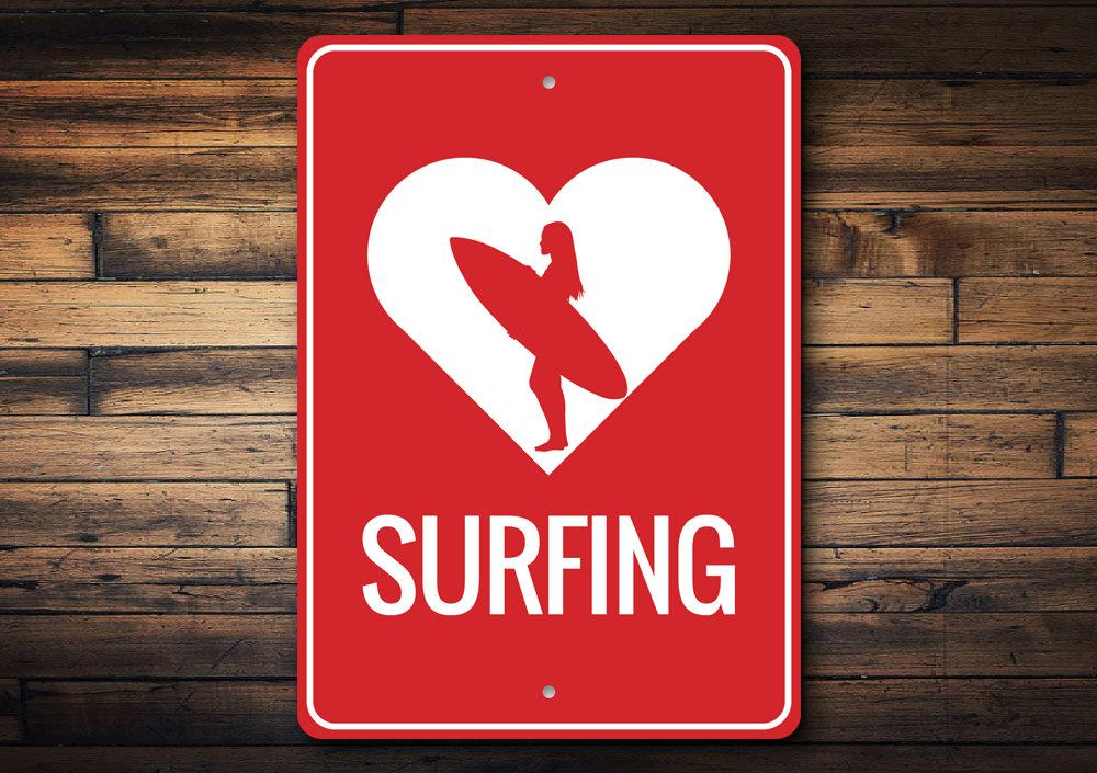 A decorative Love Surfing Sign made of aluminum, featuring vibrant colors and a beach-themed design, perfect for coastal decor.