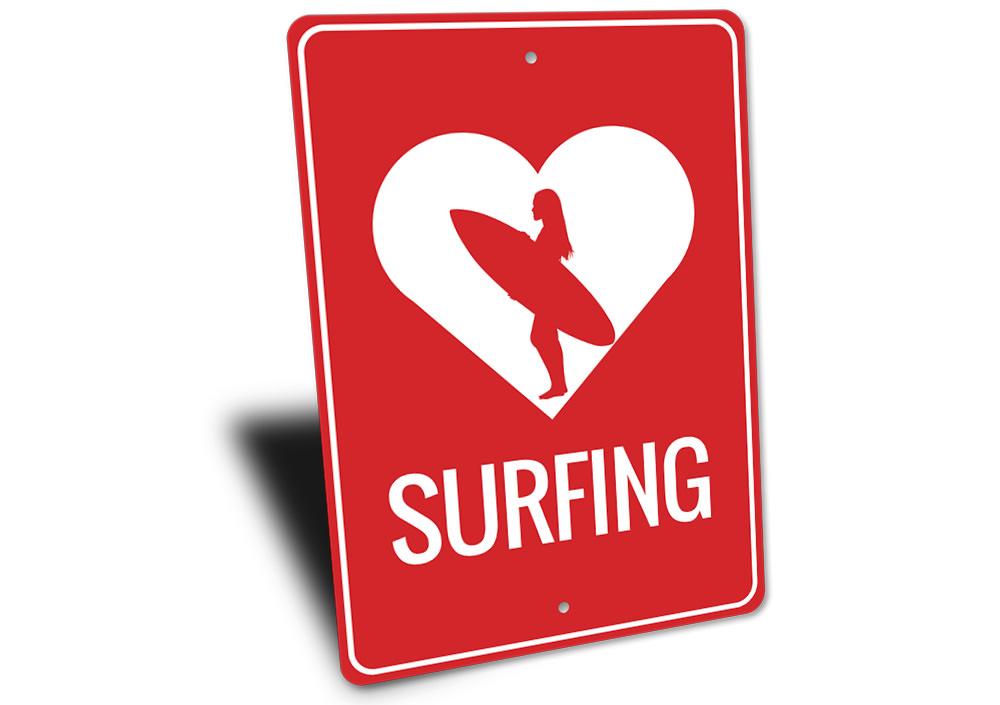 A decorative Love Surfing Sign made of aluminum, featuring vibrant colors and a beach-themed design, perfect for coastal decor.