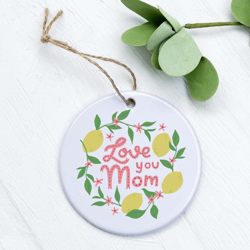 A beautifully crafted porcelain ornament featuring the phrase 'Love You Mom' with a lemon design, perfect for gifting.