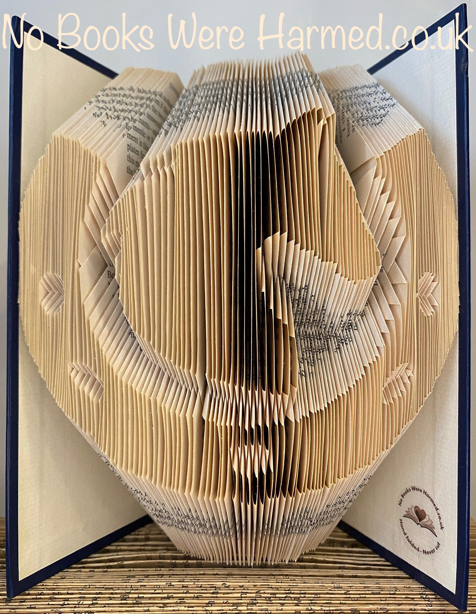 Handcrafted Lucky Horse's Head in Horseshoe made from vintage book pages, showcasing intricate folds and unique design.