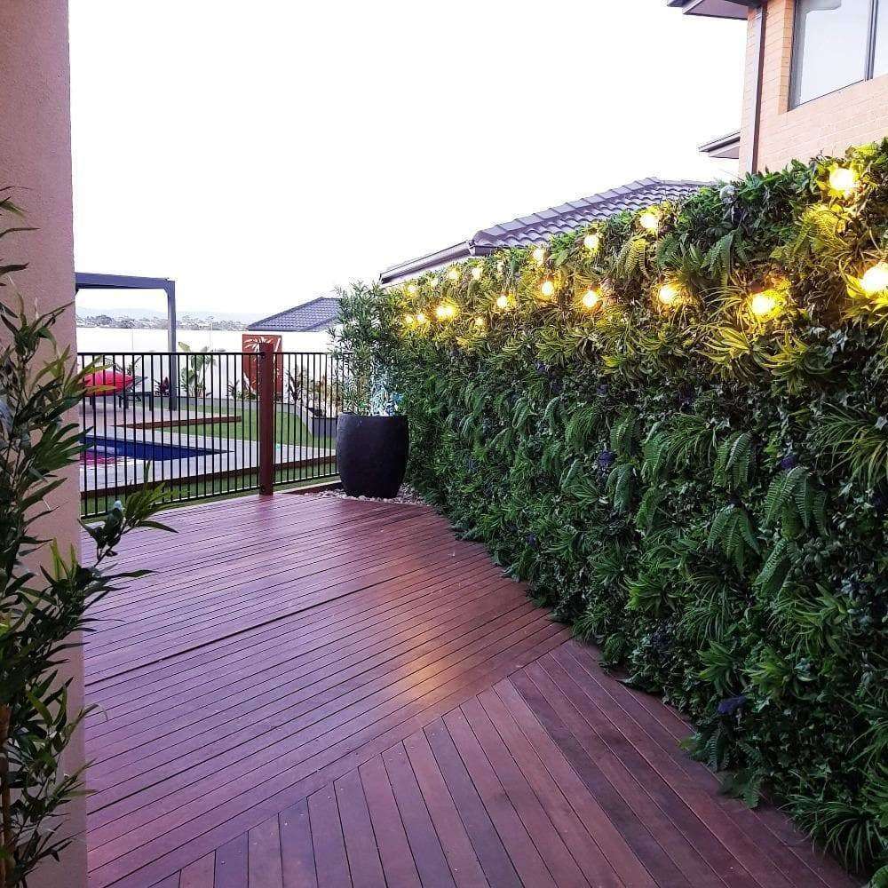 Luxury Green Sensation Artificial Vertical Garden Wall Panel showcasing a blend of grasses, ferns, and succulent-like stems, perfect for indoor and outdoor use.