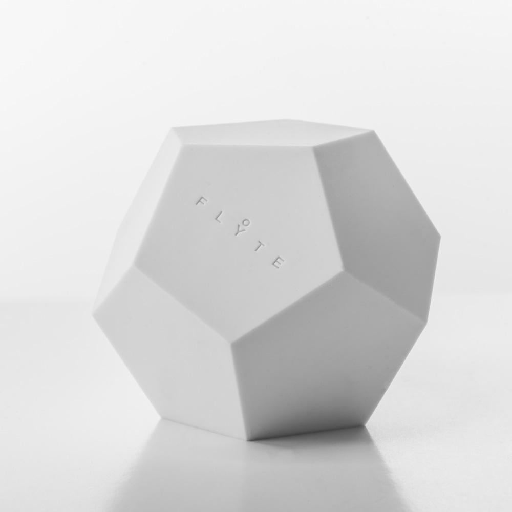 Lyfe Planter showcasing a 12-sided geodesic design, levitating a plant above an oak base, with a modern and tactile silicon finish.