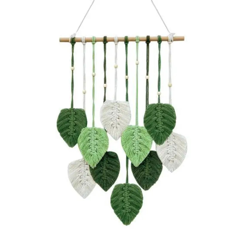 A beautifully handcrafted macrame wall hanging featuring a leaf design, made from soft green cotton rope, perfect for home decor.