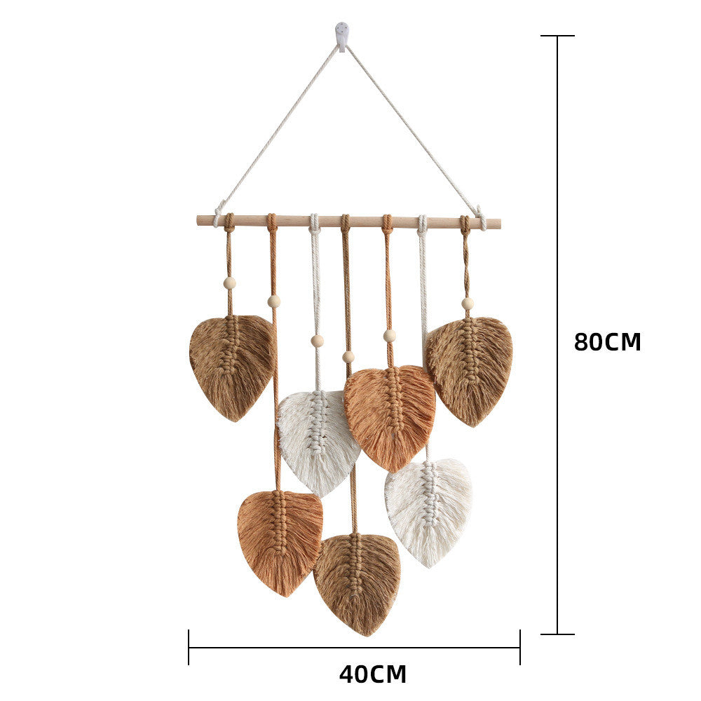 A beautifully handcrafted macrame wall hanging featuring a leaf design, made from soft green cotton rope, perfect for home decor.