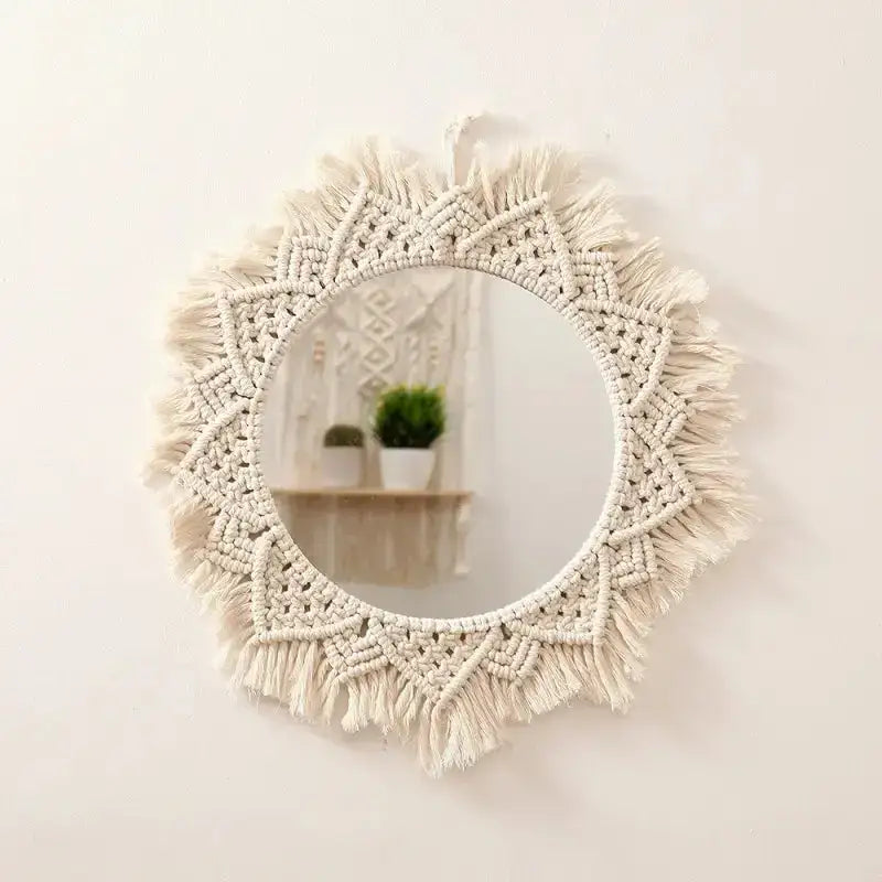 A beautifully crafted round macrame wall mirror wrapped in soft cotton rope, showcasing intricate details and a boho style.