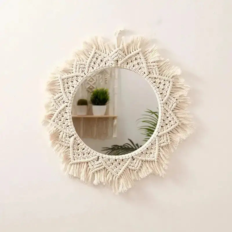 A beautifully crafted round macrame wall mirror wrapped in soft cotton rope, showcasing intricate details and a boho style.