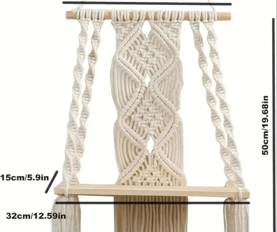 A beautifully handcrafted Macrame Wall Tapestry Plant Holder made from cotton cords, featuring a natural wooden shelf for plants or books.