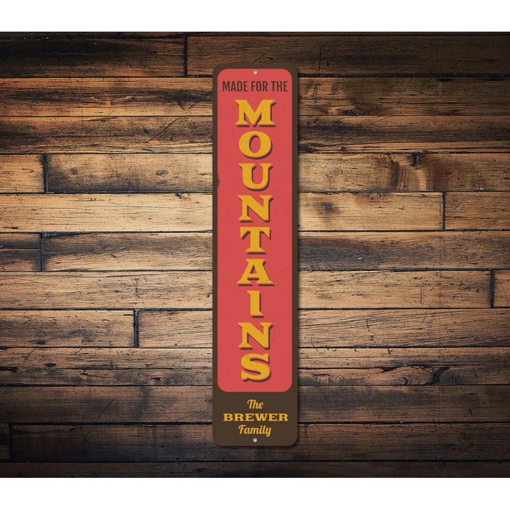 A decorative Made for the Mountains Sign made of high-quality aluminum, featuring a ski lodge theme, perfect for mountain lovers.