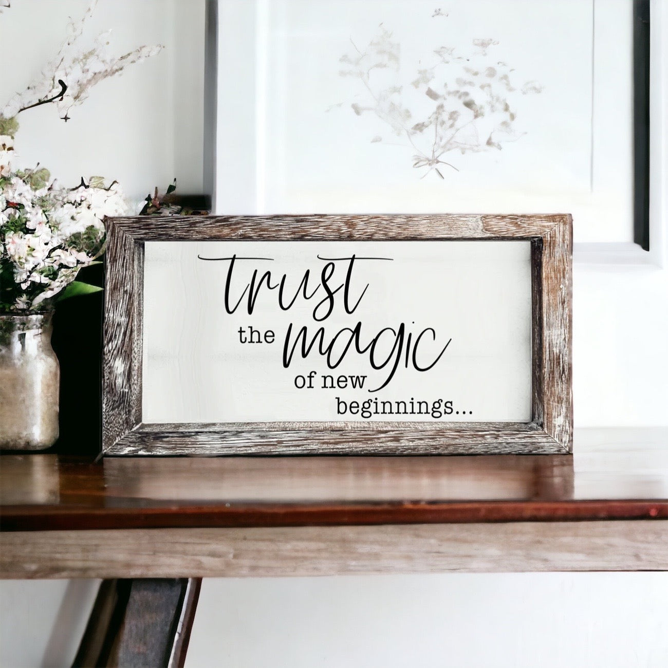 A stylish wooden sign featuring the quote 'Trust in the Magic of New Beginnings', crafted from durable Paulownia wood.