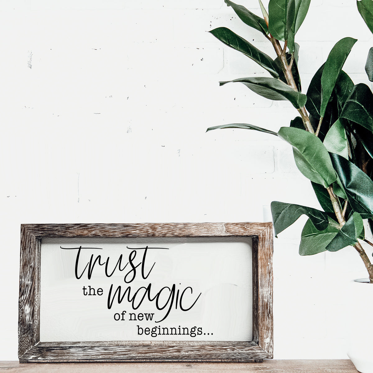 A stylish wooden sign featuring the quote 'Trust in the Magic of New Beginnings', crafted from durable Paulownia wood.