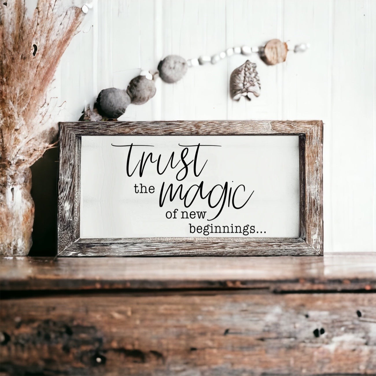 A stylish wooden sign featuring the quote 'Trust in the Magic of New Beginnings', crafted from durable Paulownia wood.