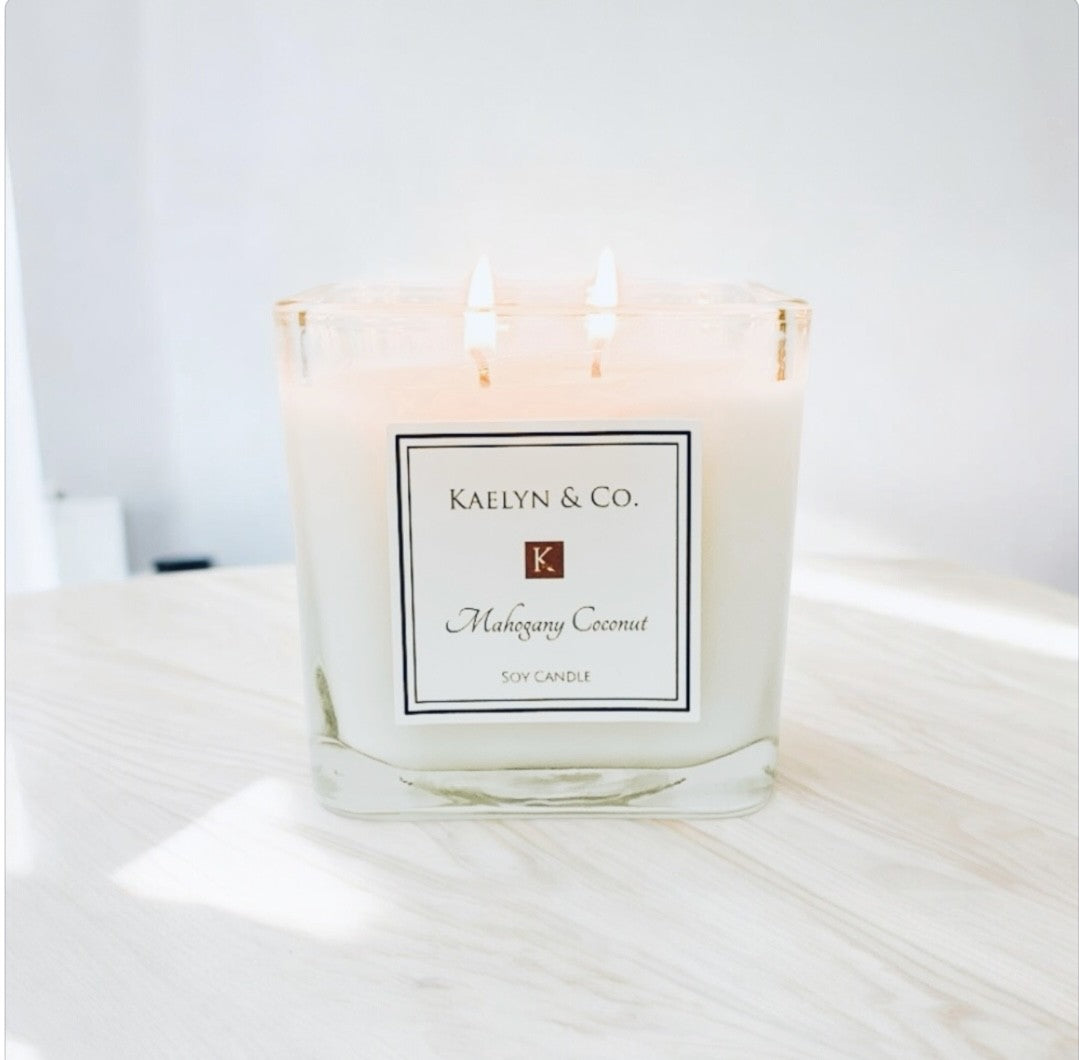 Mahogany Coconut Medium Cube Candle in an elegant gift box, showcasing its rich color and double wick design.