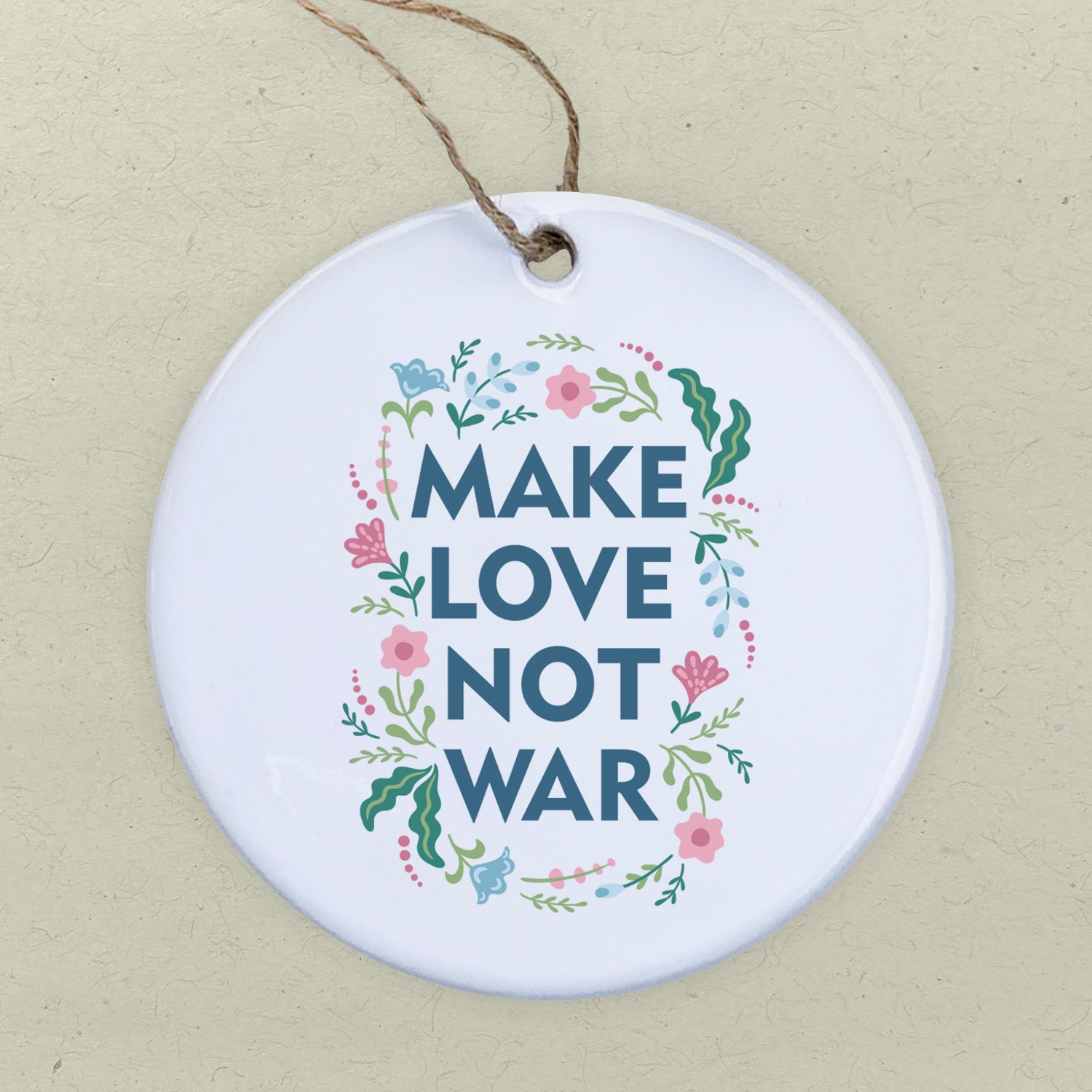 A beautifully crafted porcelain ornament featuring the phrase 'Make Love Not War', showcasing vibrant colors and a glossy finish.