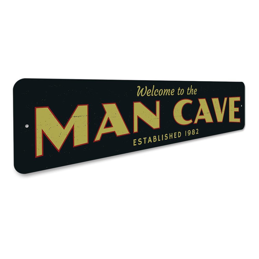 A stylish Man Cave Welcome Sign made of durable aluminum, featuring customizable text and pre-drilled holes for easy mounting.