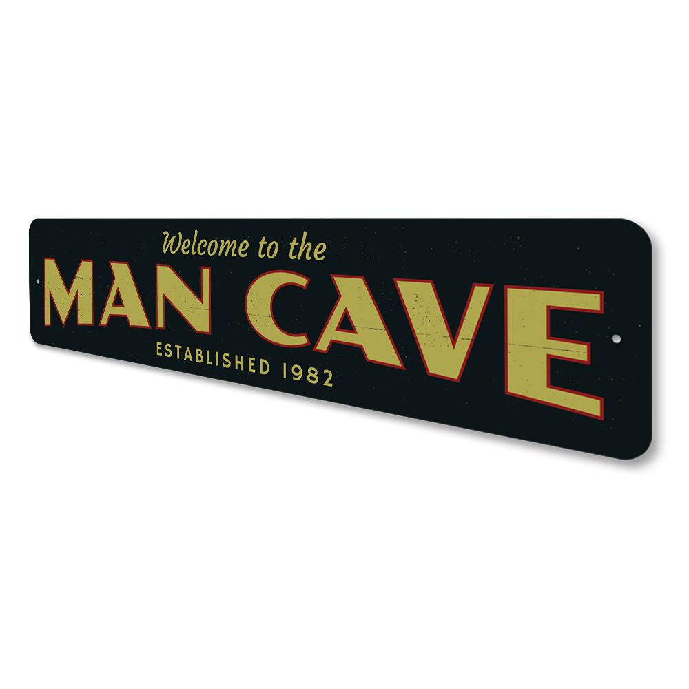 A stylish Man Cave Welcome Sign made of durable aluminum, featuring customizable text and pre-drilled holes for easy mounting.