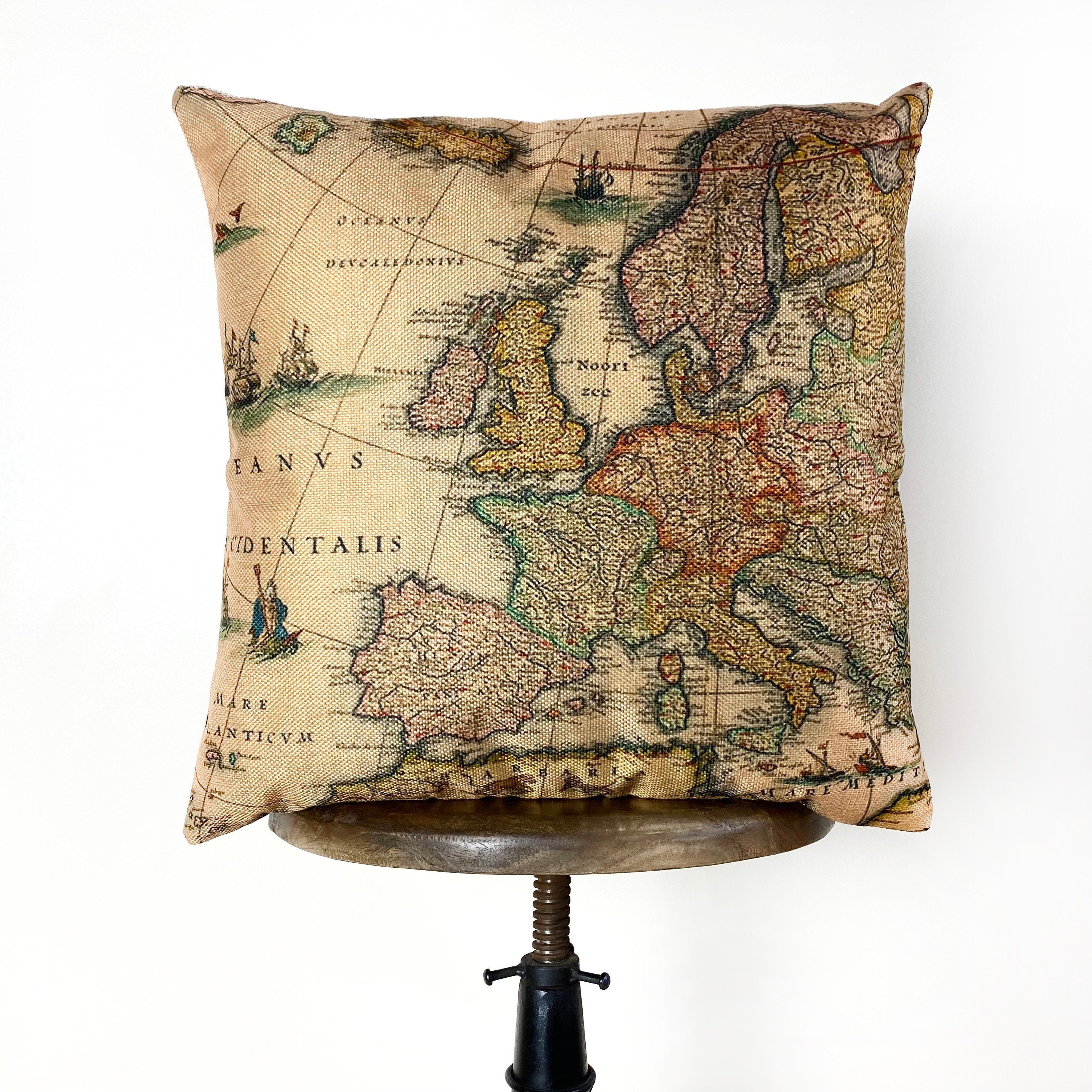 Handcrafted vintage map of Europe pillow cover on a beige background with concealed zipper.