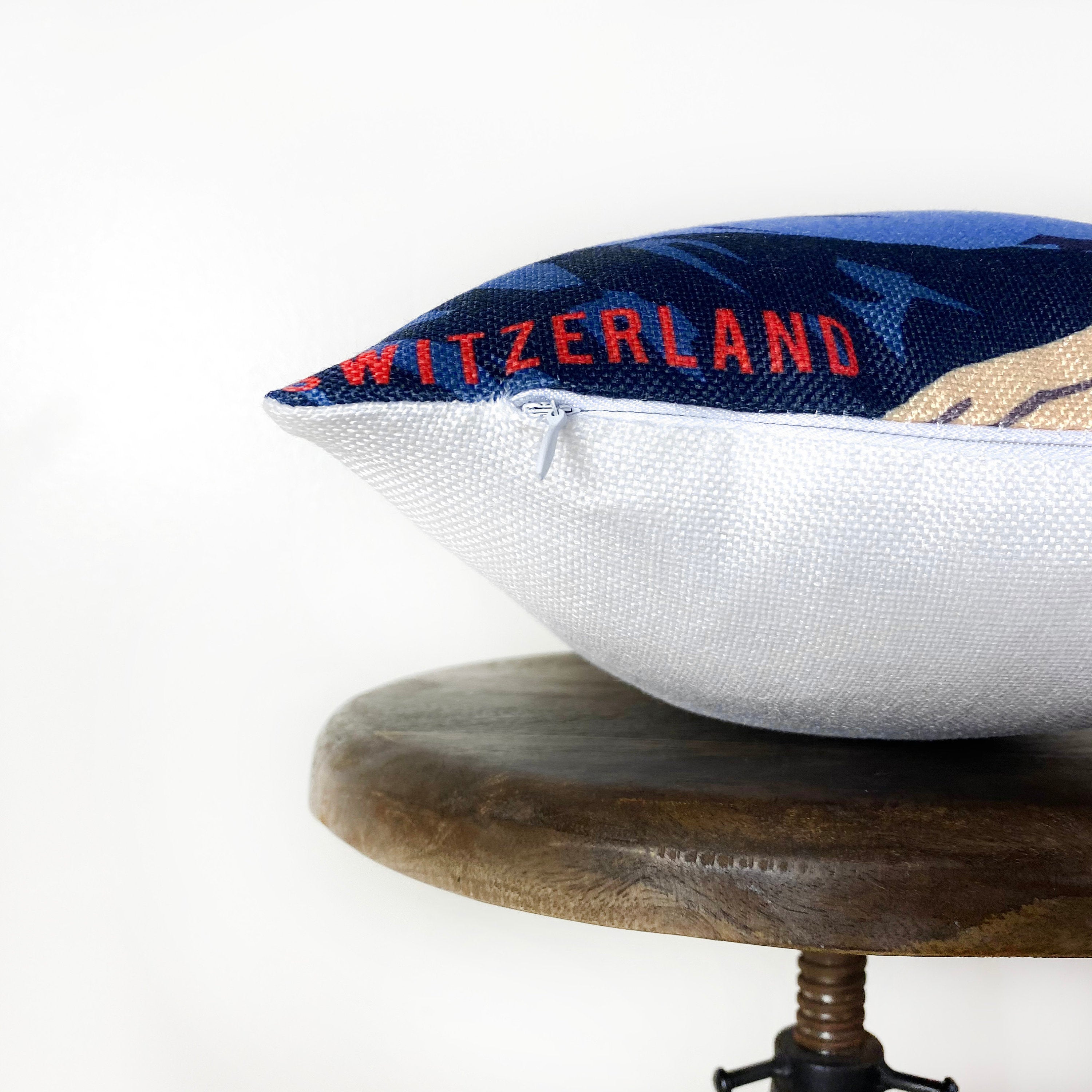 Matterhorn pillow cover featuring a vibrant travel poster design of Switzerland's iconic mountain, made from durable cotton/polyester blend.