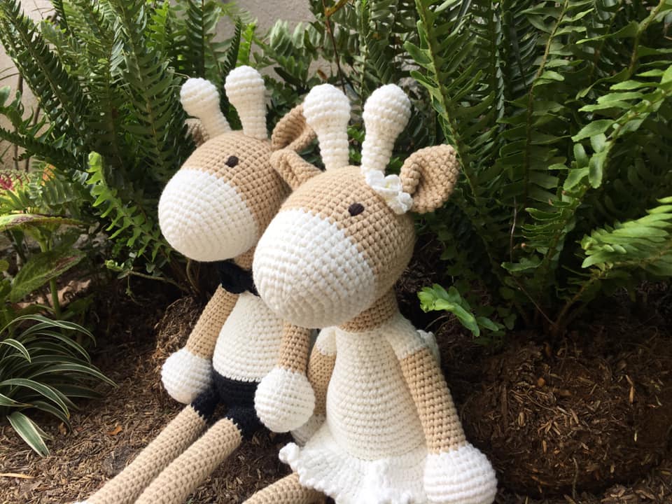 Handmade crochet toy of a deer girl, crafted from 100% cotton yarn, featuring intricate stitching and a soft, cuddly design.