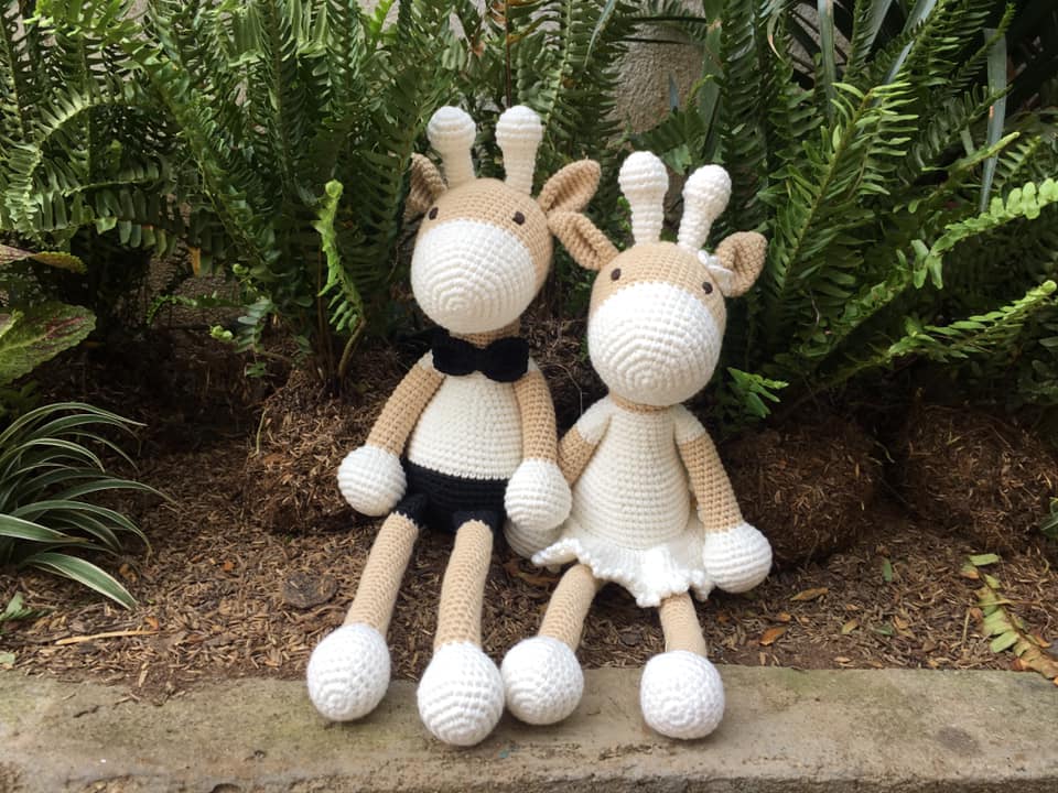 Handmade crochet toy of a deer girl, crafted from 100% cotton yarn, featuring intricate stitching and a soft, cuddly design.