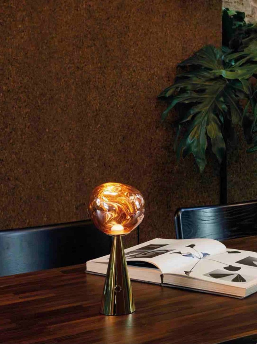 Melt Portable Dimmable LED Table Lamp showcasing a unique molten glass design with a soft glow, perfect for bedside use.