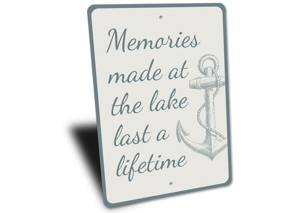 A decorative aluminum sign reading 'Memories Made at the Lake', showcasing a serene lakeside theme, perfect for lakehouse decor.