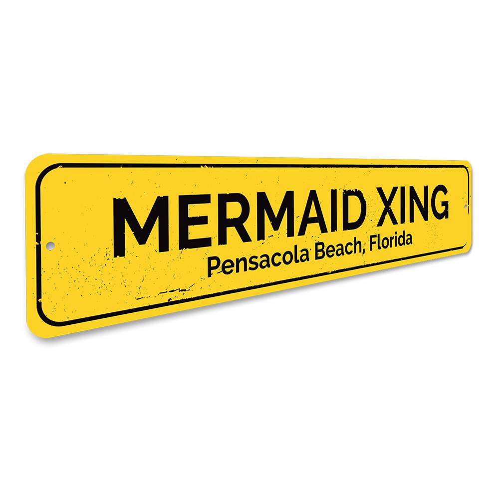 A colorful Mermaid Crossing Sign made of aluminum, featuring a whimsical design perfect for beach-themed decor.