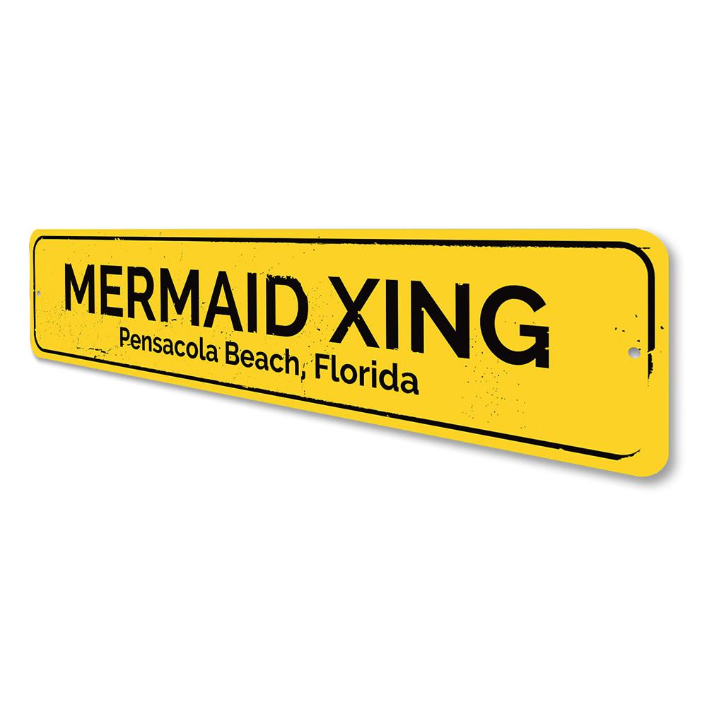 A colorful Mermaid Crossing Sign made of aluminum, featuring a whimsical design perfect for beach-themed decor.