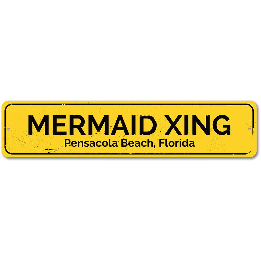 A colorful Mermaid Crossing Sign made of aluminum, featuring a whimsical design perfect for beach-themed decor.