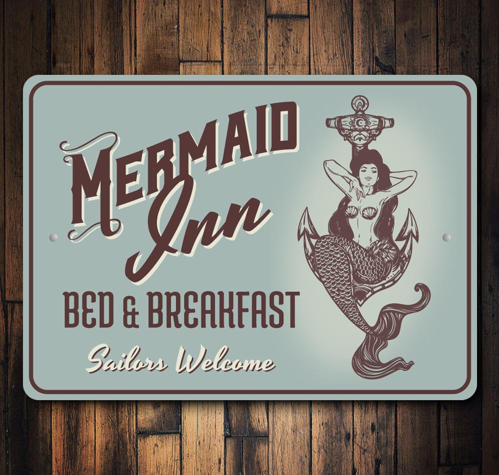 A beautifully crafted Mermaid Inn Sign made of high-quality aluminum, featuring vibrant colors and customizable text, perfect for beach-themed decor.