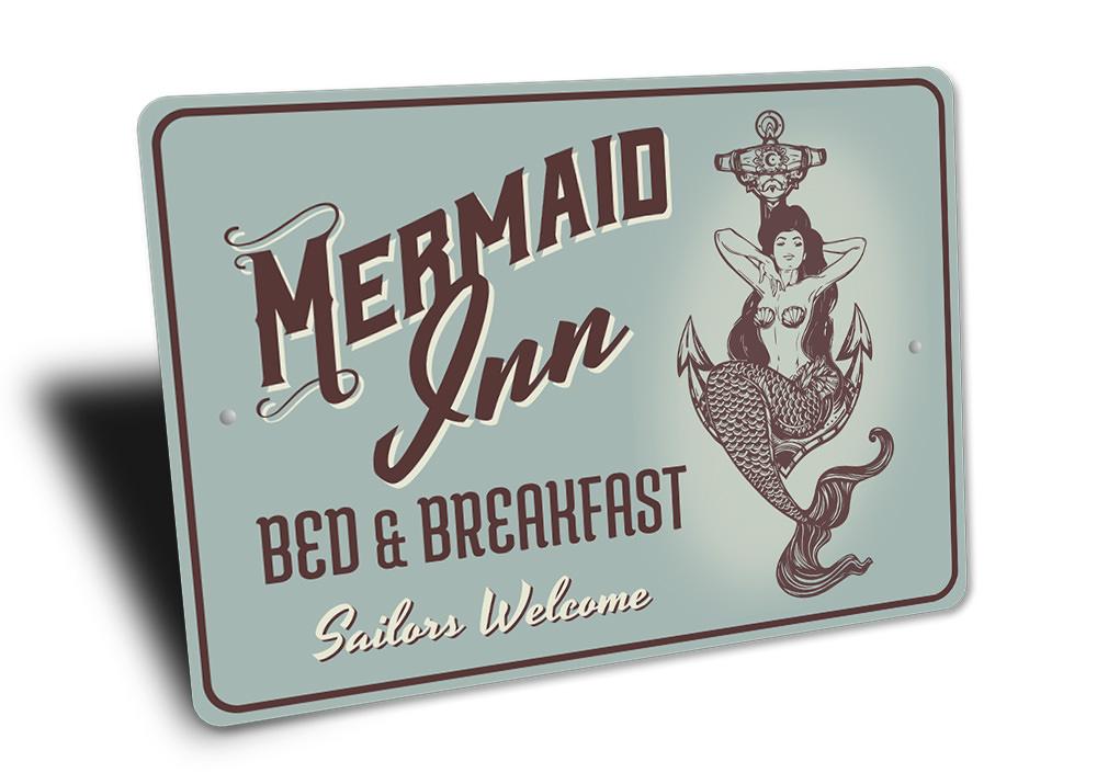 A beautifully crafted Mermaid Inn Sign made of high-quality aluminum, featuring vibrant colors and customizable text, perfect for beach-themed decor.