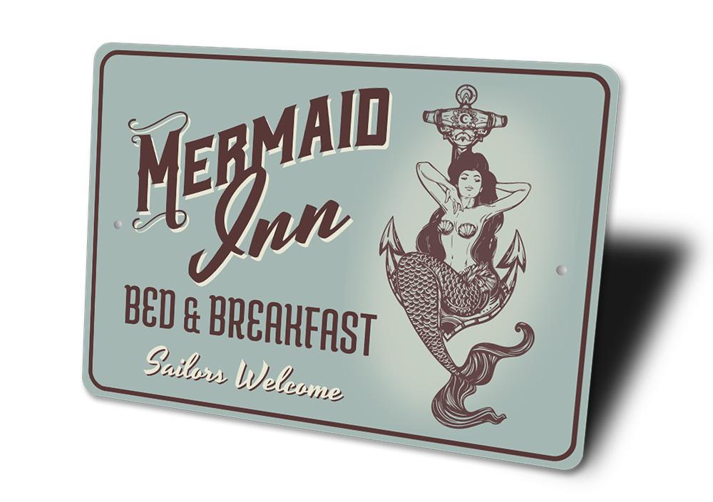 A beautifully crafted Mermaid Inn Sign made of high-quality aluminum, featuring vibrant colors and customizable text, perfect for beach-themed decor.