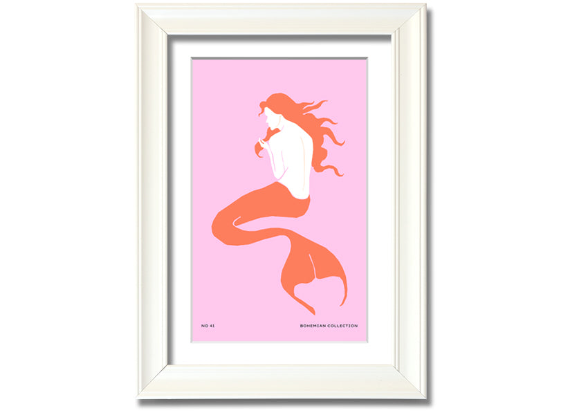 A beautifully illustrated framed print of a mermaid on a soft pink background, showcasing vibrant colors and intricate details.