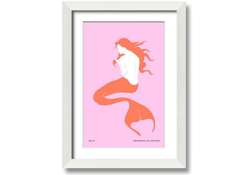 A beautifully illustrated framed print of a mermaid on a soft pink background, showcasing vibrant colors and intricate details.