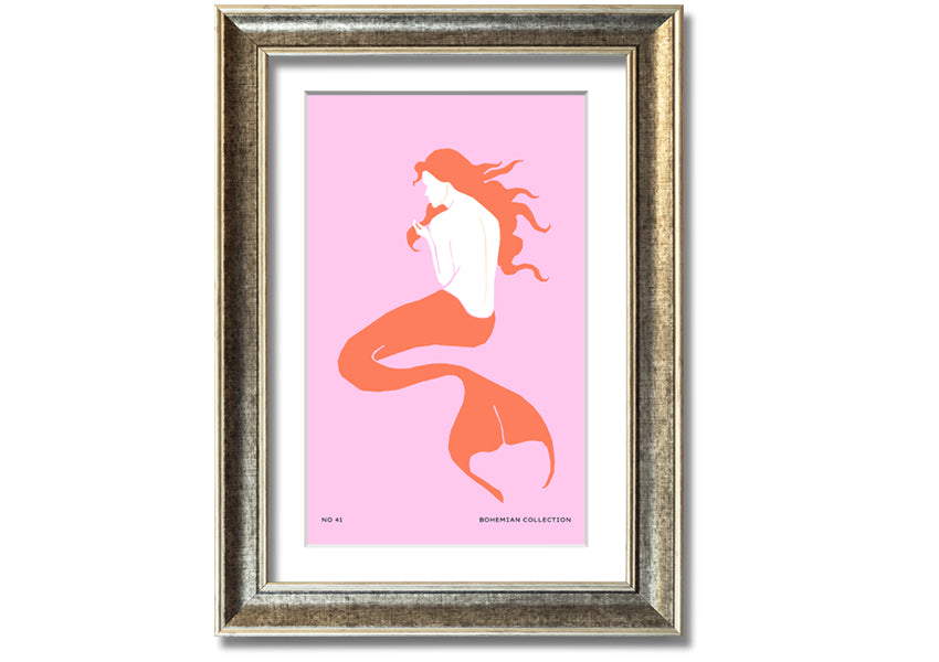 A beautifully illustrated framed print of a mermaid on a soft pink background, showcasing vibrant colors and intricate details.