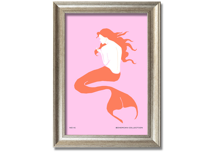 A beautifully illustrated framed print of a mermaid on a soft pink background, showcasing vibrant colors and intricate details.